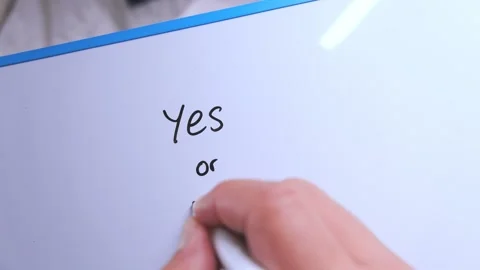 Hand writing yes or no question on whiteboard Stock Footage 325990782