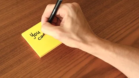 Hand Writing 'You can do it!' on Sticky Note Stock Footage 328331486