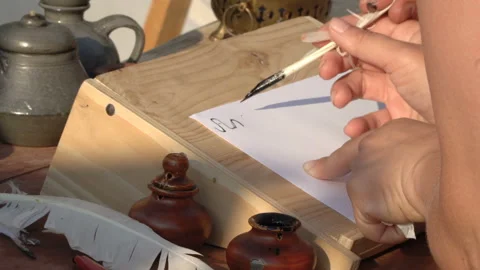 Hand written by old bird feather and ink on paper, parchment. Stock Footage 106434273