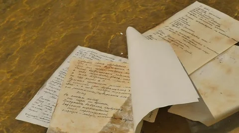 Hand-Written Paper Float on a Waves of Water Manuscript Novelette Alexander Stock Footage 64747553