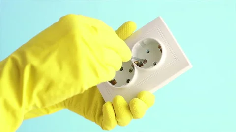 Hand in yellow  gloves using screwdriver tool screwing electric socket outlet 스톡 동영상 149726574