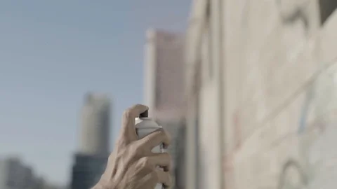 Hand of young guy use a red spray for graffiti Vídeo Stock 93726094