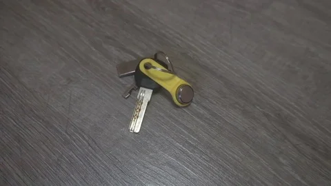 The hand of the young man takes the keys from the table,the concept of leaving Stock Footage 83629264
