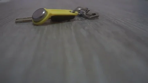 The hand of the young man takes the keys from the table,the concept of leaving Video stock 83629845