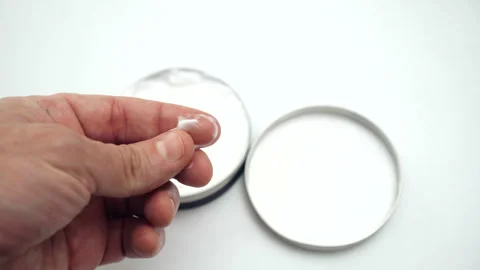 Hand Of A Young Man Taking a Sample Of Body Cream Product With His Fingers Stock Footage 255921933