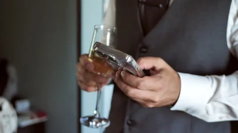 Hand of young man using mobile phone, writing message and news on smartphone Stock Footage 339179832
