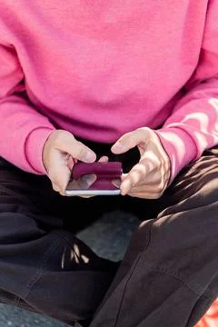 Hand of a young man using mobile phone Stock Photos