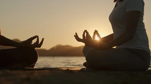 Hand of young two people practicing in lotus pose meditation while sitting Stock Footage 124816745