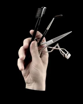 Hand_with_Equipment_for_Make-up Stock Photos