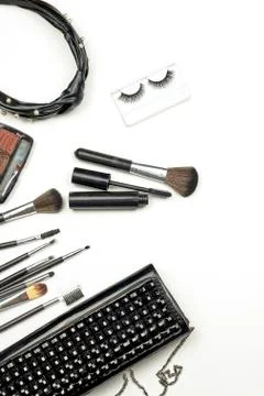Handbag with makeup set and tools on white Stock Photos