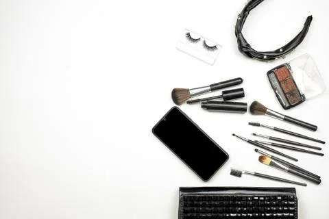 Handbag with makeup set and tools on white Stock Photos