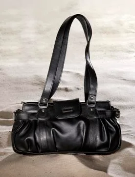 Handbag on Sand Stock Photos