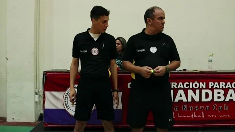 Handball Referees Standing Courtside During Official Match in Asuncion Video stock 336915266