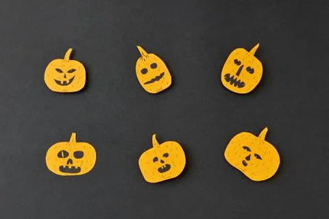 Handcraft decoratide pattern from flying smiling and laughing yellow pumpkins on Stock Photos