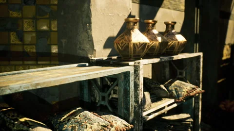 Handcrafted brass urns with embossed patterns in sunny market stall Stock Footage 329942107