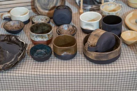 Handcrafted ceramic tableware collection on display Stock Photos