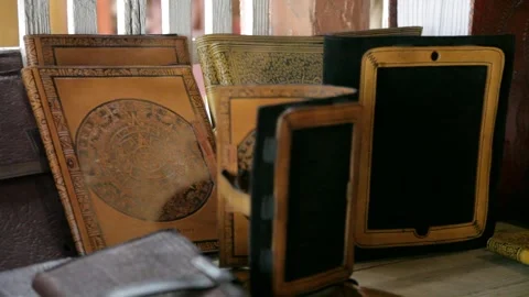 Handcrafted Leather Book and Tablet Covers on Display Stock Footage 345279164