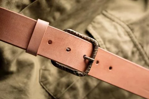 Handcrafted light brown leather strap belt Stock Photos