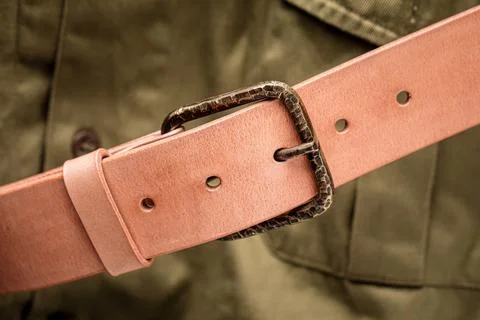 Handcrafted light brown leather strap belt Stock Photos