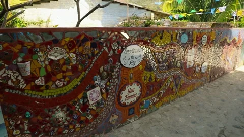 Handcrafted mosaic mural decorating a wall, featuring diverse shards and Stock Footage 332272296