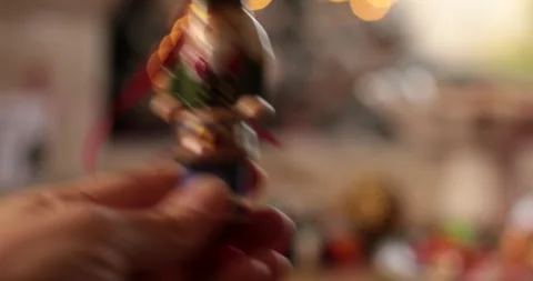 Handcrafted nutcracker ornament brings festive cheer during cozy Christmas Stock Footage 311937343