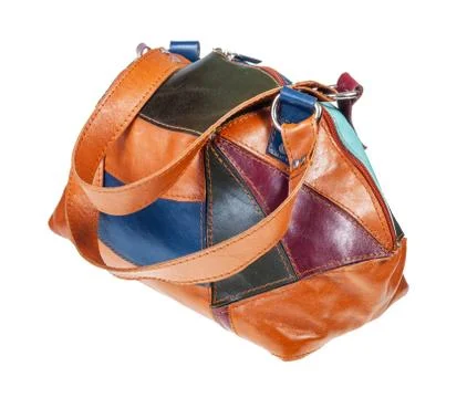 Handcrafted patchwork leather travel bag isolated Fotos de archivo