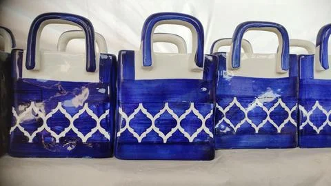 Handcrafted pots in the shape of the bag, close up view Stock Photos