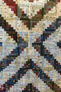 Handcrafted quilt with intricate pattern Stock Photos
