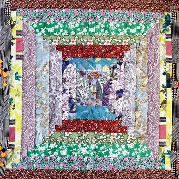 Handcrafted square patchwork quilt Stock Photos