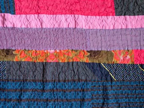 Handcrafted stitched patchwork cloth closeup 스톡 사진