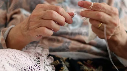 Handcrafted traditional knitting. Cover with thread Stock-Footage 204785896