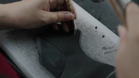 Handcrafting Leather Shoe Upper with Punch Tool in Factory Workshop Close Up Stock Footage 341667185