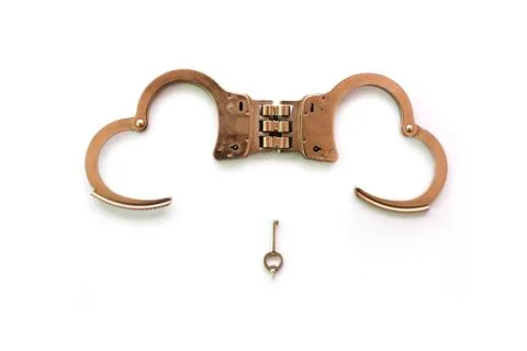 Handcuff in form of heart shape with key on white background, Release Love co Stock Photos