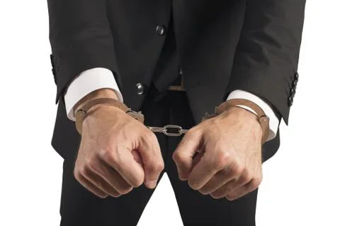 Handcuffed businessman in jail Stock Photos