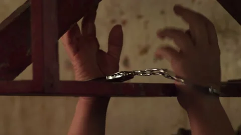 Handcuffed hands Stock Footage 172222485