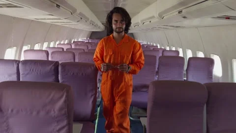 Handcuffed Man Walking in Airplane Stock Footage 281495752
