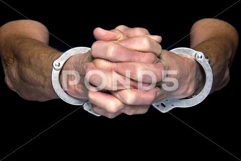 Handcuffed person Stock Photos