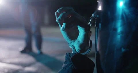 Handcuffed suspect, Cuffed to Car Door Handle. At Crime Scene. Dead hand. Stock Footage 271207164