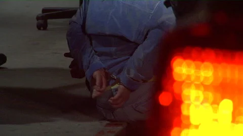Handcuffed suspect with light Stock Footage 45499708