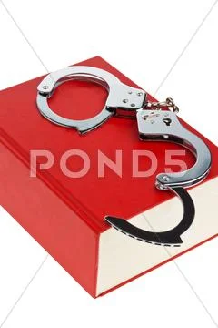 Handcuffs and code Stock Photos