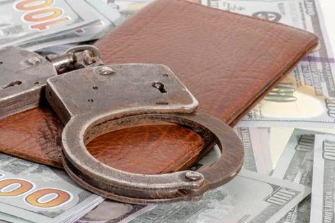 Handcuffs and a dollar. Foto stock