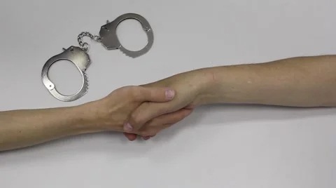 Handcuffs Binding Agreement Handshake Stock Footage 45921941