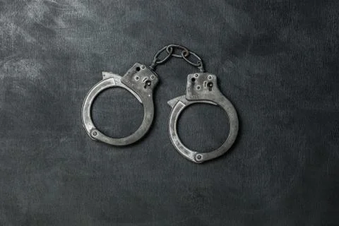The Handcuffs on black background Foto stock