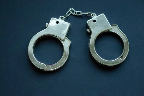 Handcuffs on black Stock Photos