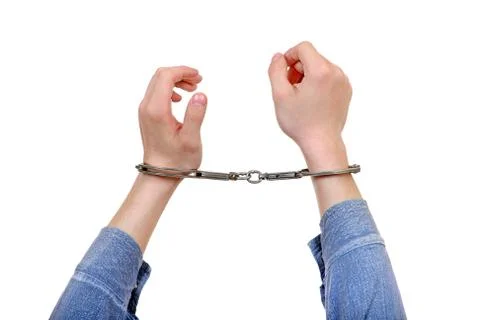 Handcuffs on Hands Closeup Stock-Fotos