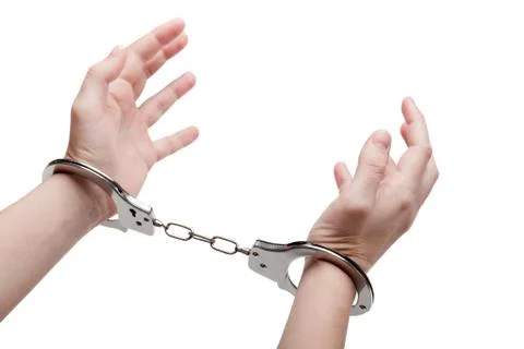 Handcuffs on hands Stock Photos