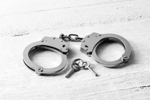 Handcuffs with keys Stock Photos