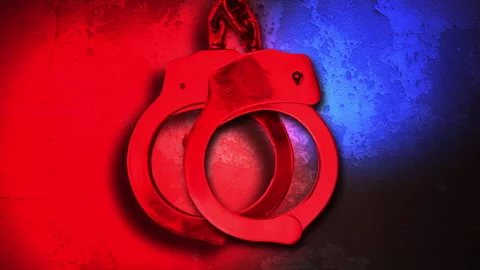 Handcuffs with police lights 4k loop Stockbeeldmateriaal 273343441