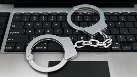 Handcuffs standing on laptop computer keyboard. 3D illustration Stock Illustration