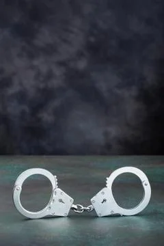 Handcuffs on table Fotos de archivo